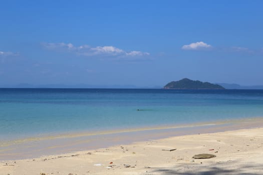 Beautiful white sand beach on island with crystal clear sea, Andaman sea, Thailand