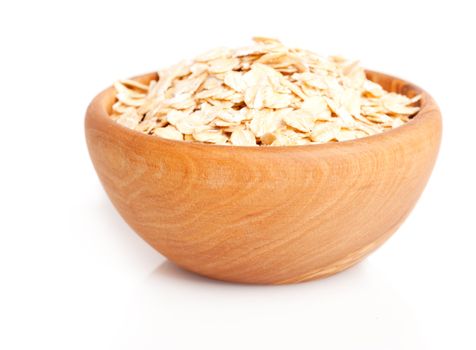 oat flakes in the wooden bowl.