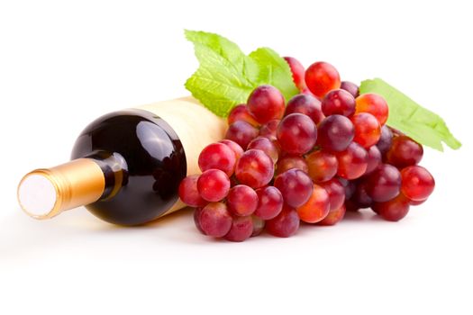 bottle of red wine and grapes, isolated on white background.