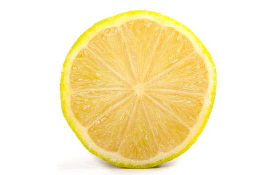 Single cross section of yellow lemon, isolated on white background.