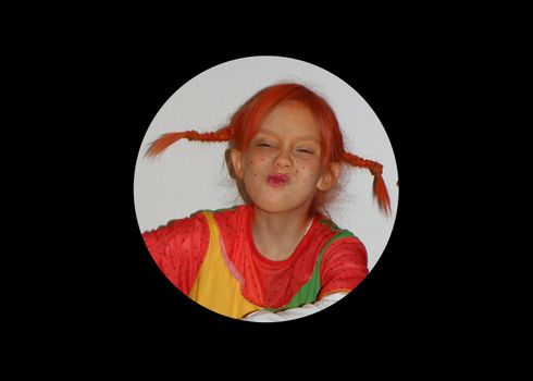 Photo of a girl to the children's Carnival, disguised as Pipi Longstocking.