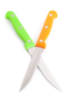 Two color crossed knifes isolated on a white background