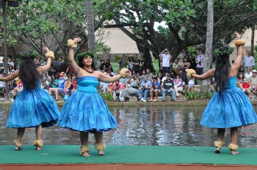 Students perform traditional Hawaiian dance at a canoe pageant at the Polynesian Cultural Center in Oahu, Hawaii