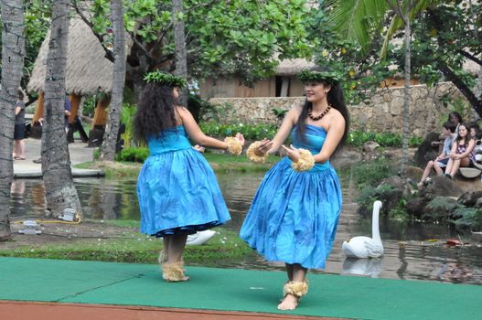 Students perform traditional Hawaiian dance at a canoe pageant at the Polynesian Cultural Center in Oahu, Hawaii