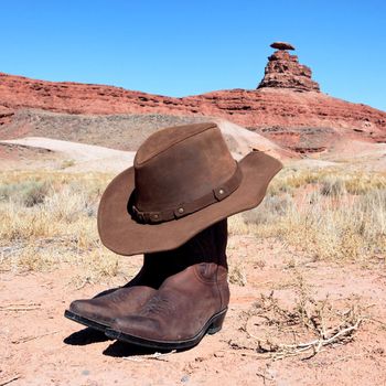 boots and hat in front of famous mexican hat rock