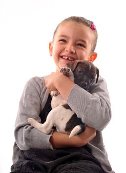 laughing little girl and her purebred puppy jack russel terrier