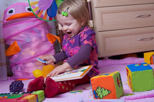 Baby girl collecting jigsaw in nursery