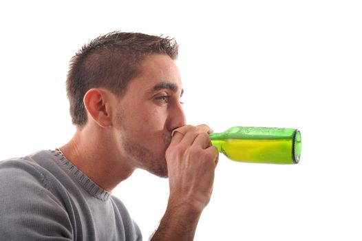 a young man drinking a beer in the bottle