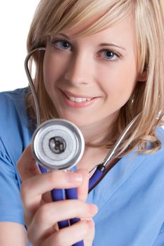 Smiling pretty nurse holding stethoscope