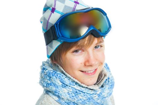 Clouse up portrait of a caucasian cute teenager in ski goggles and a scarf, isolated on white