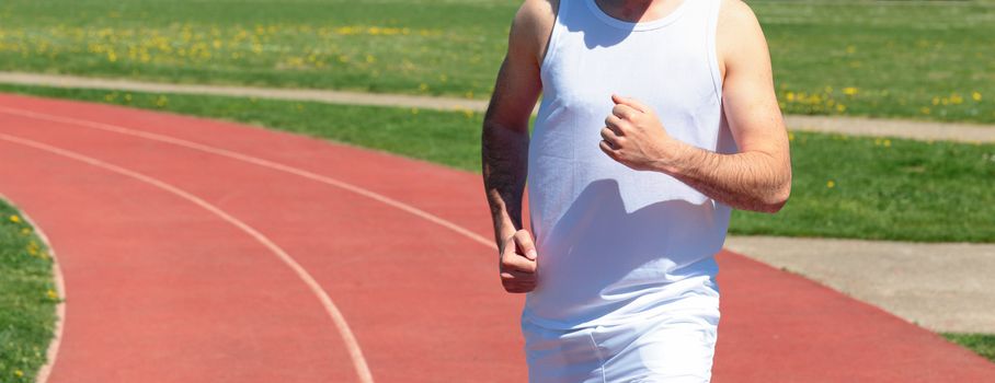 panoramic view of man running on a track