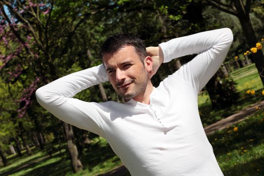 relaxed handsome man in a park