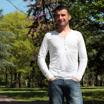 handsome man in a park in spring