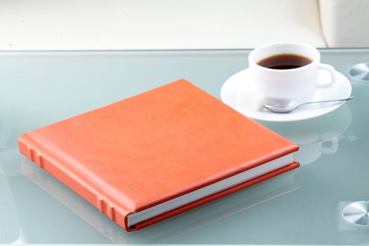 orange leather book on bright background