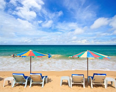 Colorful Umbrella and chair on the beach
