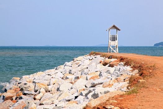 dirt pathway to wooden vintage lighthouse