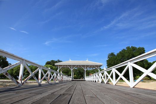 wooden jetty walkway with pavillion in Srichang Island Thailand with blue sky