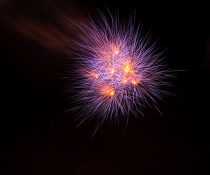 Orange and Violet  Fireworks on Dark Sky