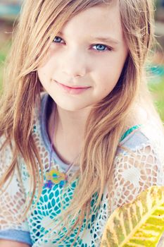 Portrait of a blode girl outdoors in the park