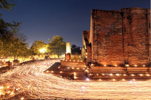 candle light trail of Buddhism Ceremony at temple ruin on Asalha Puja day