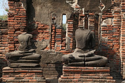 headless buddha statue in temple ruin , bangkok thailand