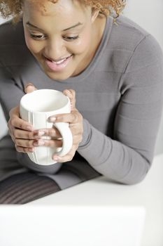 Beautiful young business woman taking a break at her desk