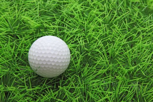 closeup of golf ball on green grass