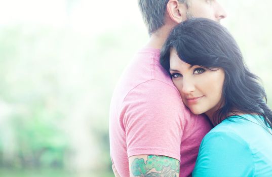 Portraite of a happy couple outdoors in the park 