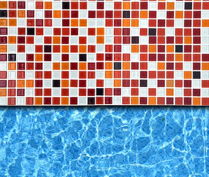 red mosaic pavement with pool background
