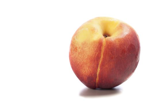 Fresh ripe nectarine on an isolated background