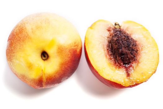 Whole and sliced fresh ripe Nectarines on an isolated background