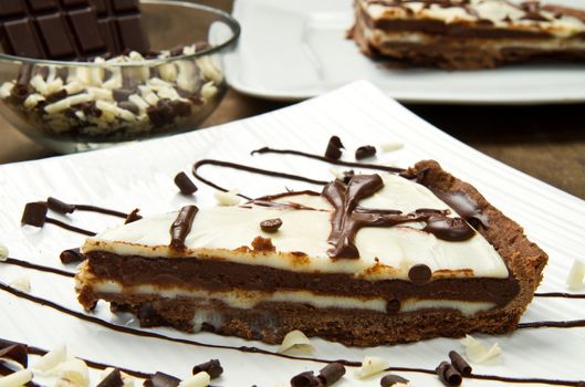 white dish with chocolate cake