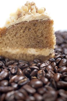 Fresh coffee cake surrounded by dried coffee beans