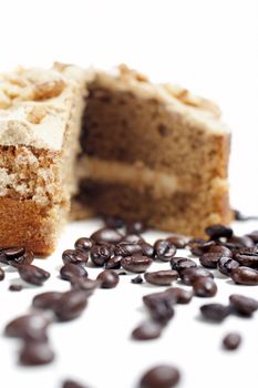 Fresh coffee cake surrounded by dried coffee beans