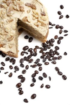 Fresh coffee cake surrounded by dried coffee beans