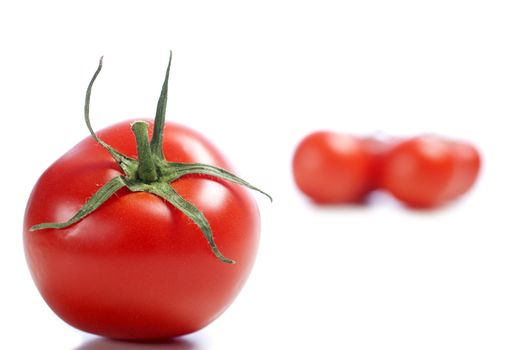 Fresh ripe tomato on isolated background