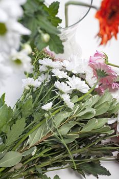 Flower cuttings being prepared to be arranged to make a bouquet.