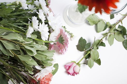 Flower cuttings being prepared to be arranged to make a bouquet.