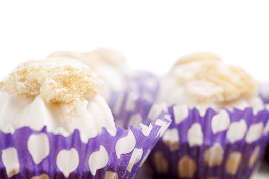 Freshly baked cup cakes with cream filling in cake trays