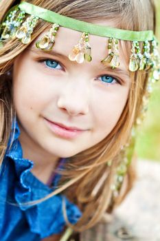 Portrait of a blode girl outdoors in the park 