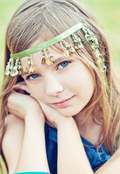 Portrait of a blode girl outdoors in the park 