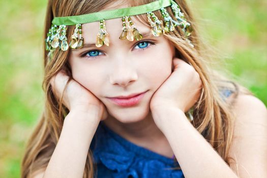 Portrait of a blode girl outdoors in the park 