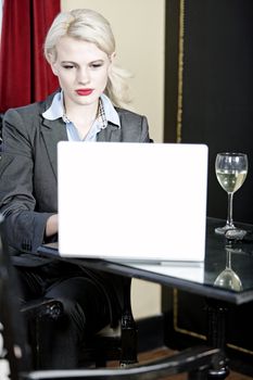 Attractive woman working on her laptop catching up after a long day.