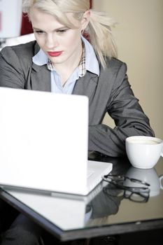 Attractive woman working on her laptop catching up after a long day.