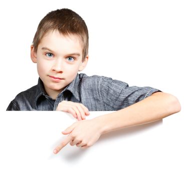 Child pointing his finger on blank white board