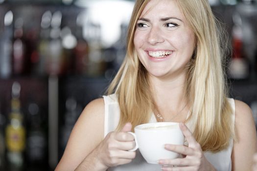 attractive woman waiting for someone at a wine bar.