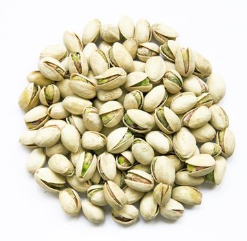 Delicious pistachios isolated on white background