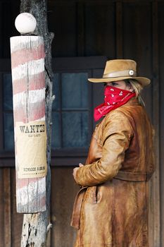 Portrait of a wanted cowgirl. Western style 