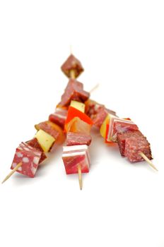 Salami Shishkabobs with red bell pepper and cheese isolated on white background