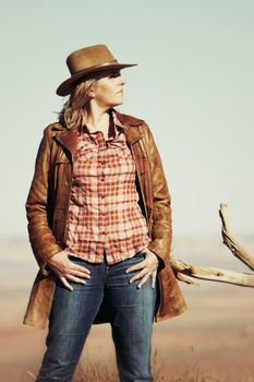 beautiful blond cowgirl in the desert, Utah, USA